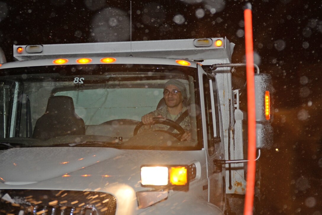 Airman 1st Class Lucky Edwards, a 28th Civil Engineer Squadron heavy equipment operator, drives a chip truck during a snowstorm at Ellsworth Air Force Base, S.D., April 13, 2018. Non-essential base functions were suspended due to inclement weather, but heavy equipment operators continued on staggered shifts to remove snow and improve driving conditions. (U.S. Air Force photo by Airman 1st Class Nicolas Z. Erwin)