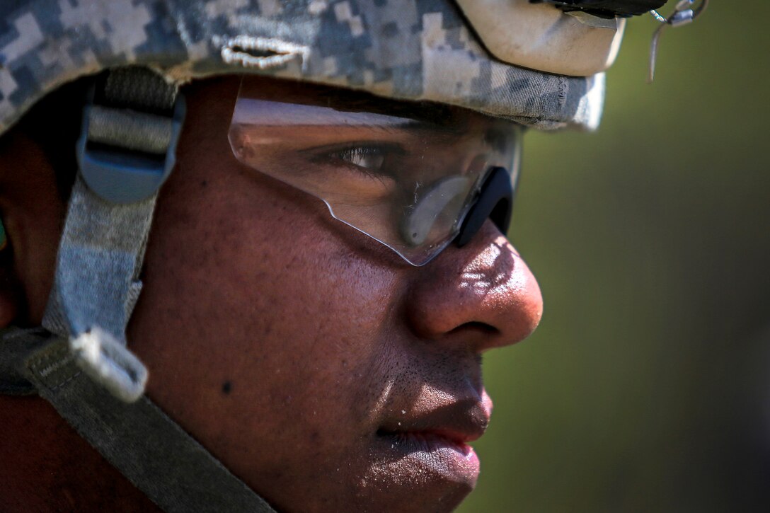 A soldier waits for orders during training.
