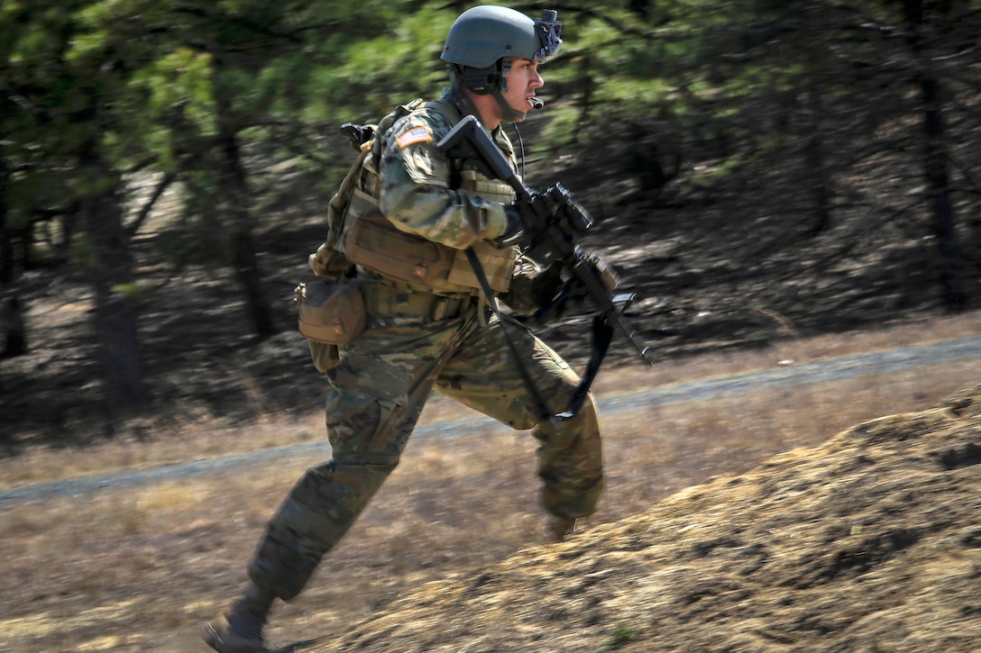 A soldier rushes toward his next firing position.