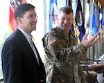 Lt. Gen. Jeffrey S. Buchanan (right), commander, U.S. Army North (Fifth Army), briefs ARNORTH’s functions and capabilities with the 23rd Secretary of the Army, Dr. Mark T. Esper inside of the historic Quadrangle at Joint Base San Antonio-Fort Sam Houston April 17. The Quadrangle serves as the headquarters building for ARNORTH operations.