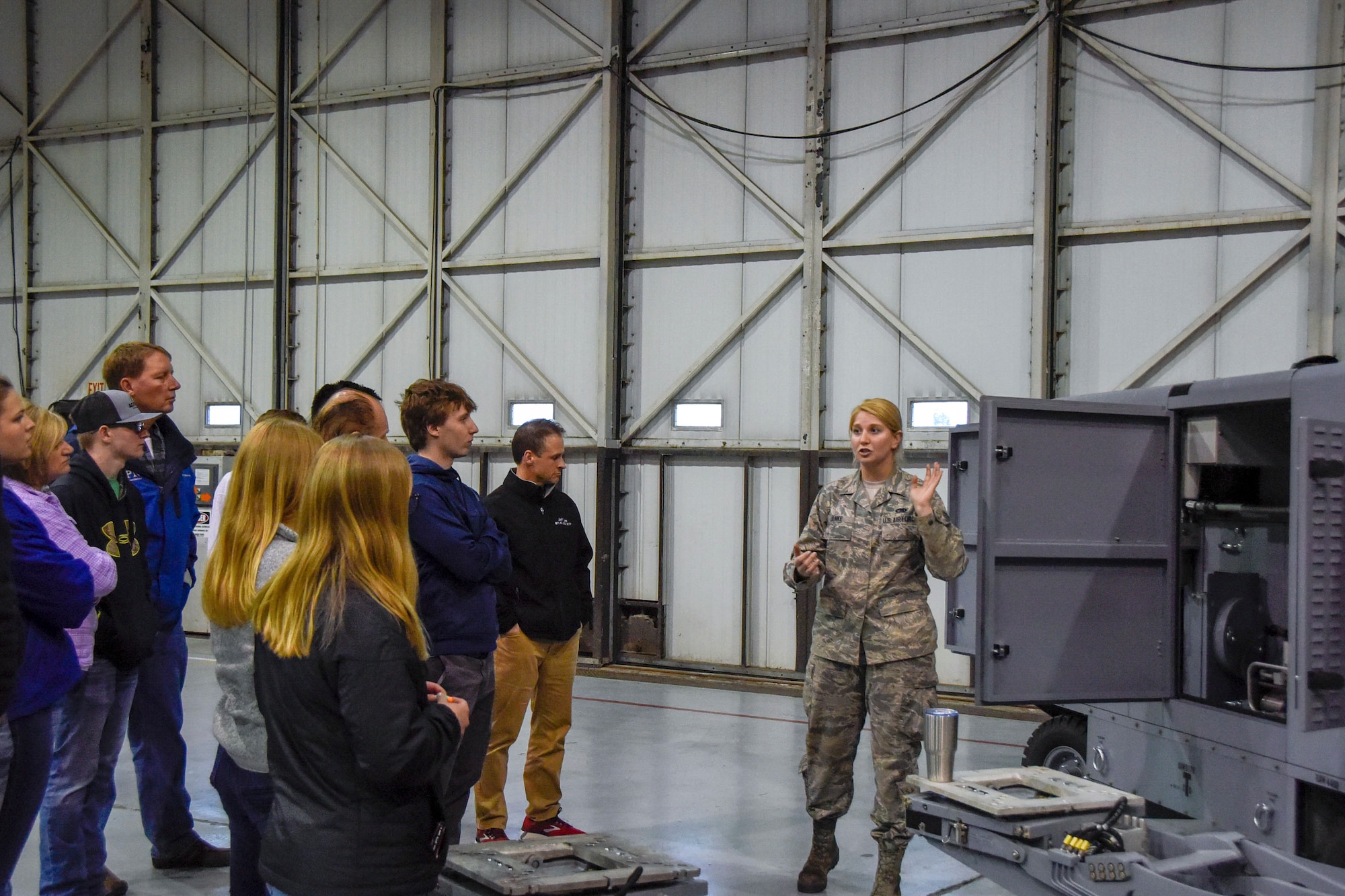 Staff Sgt. Jessica Janke, 114th Maintenance Squadron aerospace ground equipment technician, talks about her career field and experiences in the military during Night Flying Career Day at Joe Foss Field, S.D. on April 17, 2018.