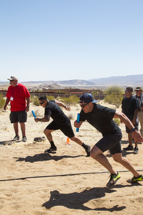 Deputies from the San Bernardino County Sheriff’s Department compete in the 40-meter dash relay race at the inaugural Tug-of-War Competition hosted by the Desert Refuge for Peace Officers and Military Personnel in Joshua Tree, Calif., April 14, 2018. The event also included barbecue lunch, live music, giveaways and inter-faith prayer services. (U.S. Marine Corps photo by Cpl. Dave Flores)