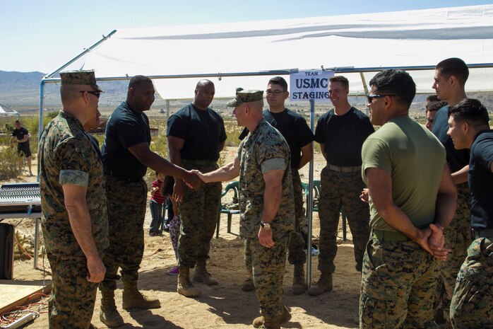 Maj. Gen. William F. Mullen III, Marine Corps Air Ground Combat Center Commanding General, and Sgt. Maj. Michael Hendges, Combat Center Sergeant Major, speak to the Marines competing in the inaugural Tug-of-War Competition hosted by the Desert Refuge for Peace Officers and Military Personnel in Joshua Tree, Calif., April 14, 2018. The event also included barbecue lunch, live music, giveaways and inter-faith prayer services. (U.S. Marine Corps photo by Cpl. Dave Flores)