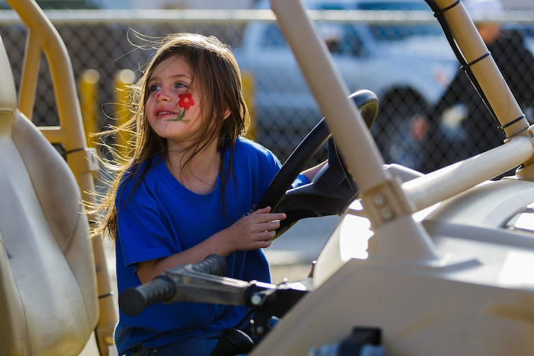 Lillian Benavidez, 6, daughter of Staff Sgt. Guadalupe Benavidez, career planner, 2nd Battalion, 7th Marine Regiment, explores a Polaris MRZR D4 that was on display during the 4th Annual Earth Day Extravaganza aboard the Marine Corps Air Ground Combat Center, Twentynine Palms, Calif., April 13, 2018. The purpose of the extravaganza is to bring families together and educate them on how to be better stewards of the Earth’s resources. (U.S. Marine Corps photo by Lance Cpl. Rachel K. Porter)