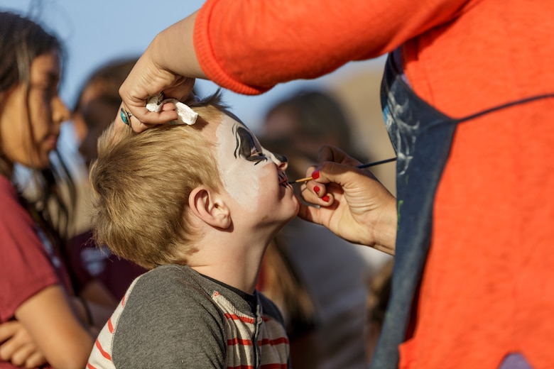 A child gets his face painted by a volunteer during the 4th Annual Earth Day Extravaganza aboard the Marine Corps Air Ground Combat Center, Twentynine Palms, Calif., April 13, 2018. The purpose of the extravaganza is to bring families together and educate them on how to be better stewards of the Earth’s resources. (U.S. Marine Corps photo by Lance Cpl. Rachel K. Porter)