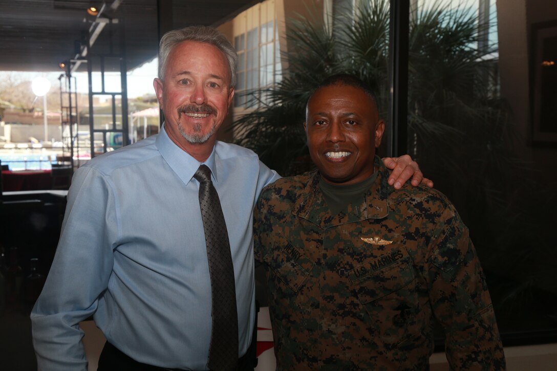 Brig. Gen. Dimitri Henry, U.S. Marine Corps Director of Intelligence, (right) attends Larry Stratton's, former Deputy Director of Marine Corps Community Services, retirement ceremony at the Frontline Restaurant aboard the Marine Corps Air Ground Combat Center, Twentynine Palms, Calif., March 29, 2018. Stratton, a retired Marine Corps master sergeant, was Henry's drill instructor at Marine Corps Recruit Depot San Diego, Calif., in 1981. (U.S. Marine Corps photo by Lance Cpl. Preston L. Morris)