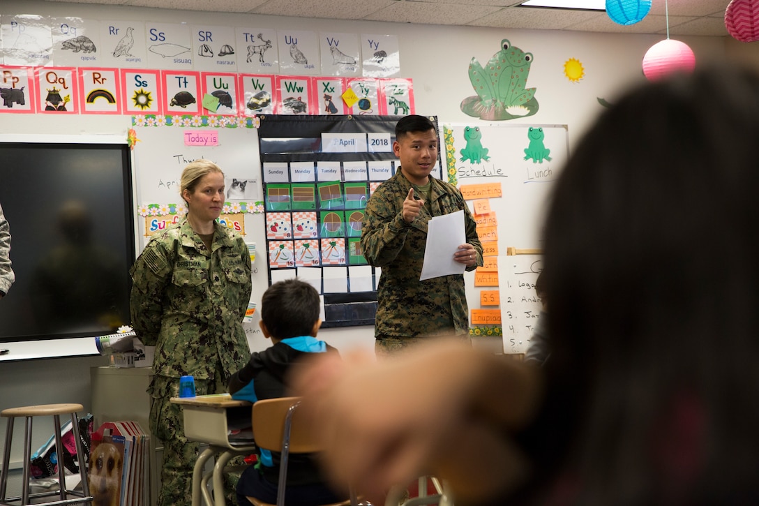 Marine Corps Cpl. Chandarong Ouk, an embarkation specialist with 4th Medical Battalion, 4th Marine Logistics Group, talks with students during a career day at the Kotzebue Elementary School, Kotzebue, Alaska, April 19, 2018.