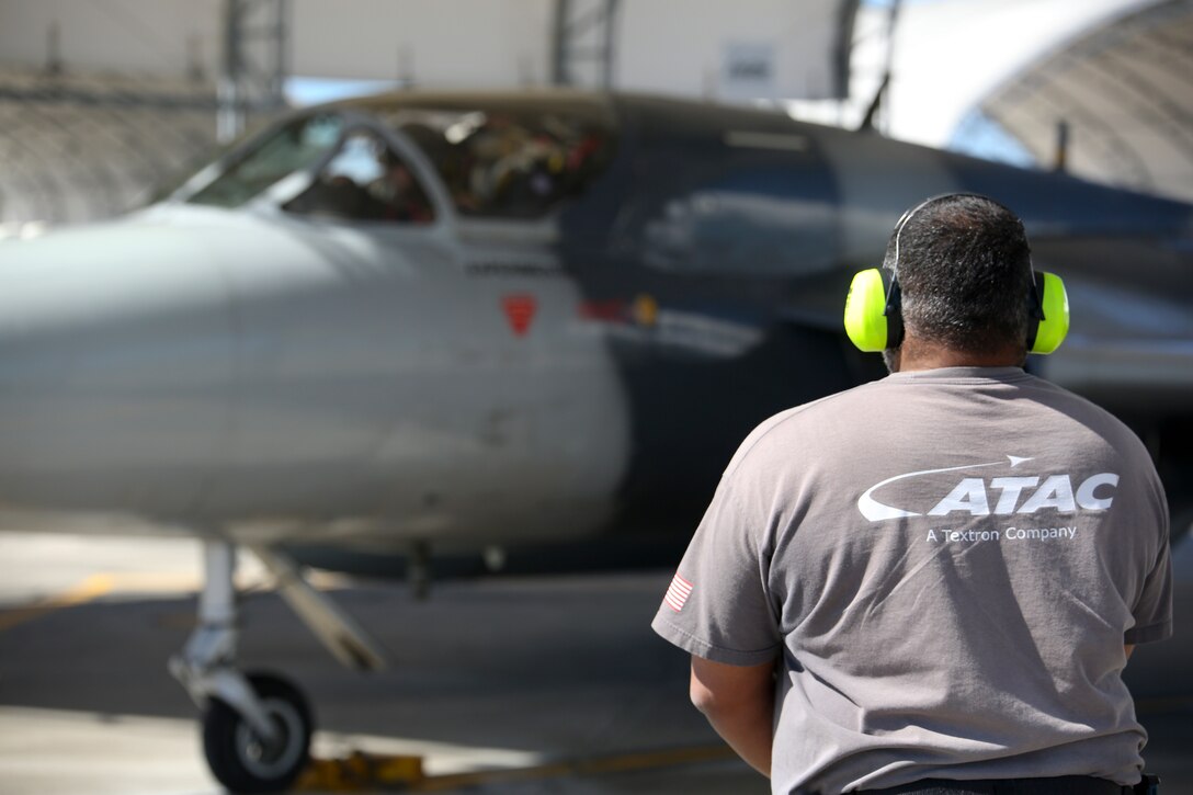 A crew chief watches as an MK-58 Hawker Hunter taxis on to the runway aboard Marine Corps Air Station Beaufort April 18. The Hawker Hunter and crew are training with Marine Fighter Attack Training Squadron 501 for multiple weeks to support dissimilar air combat training for F-35 pilots. The aircraft is with the Airborne Tactical Advantage Company.