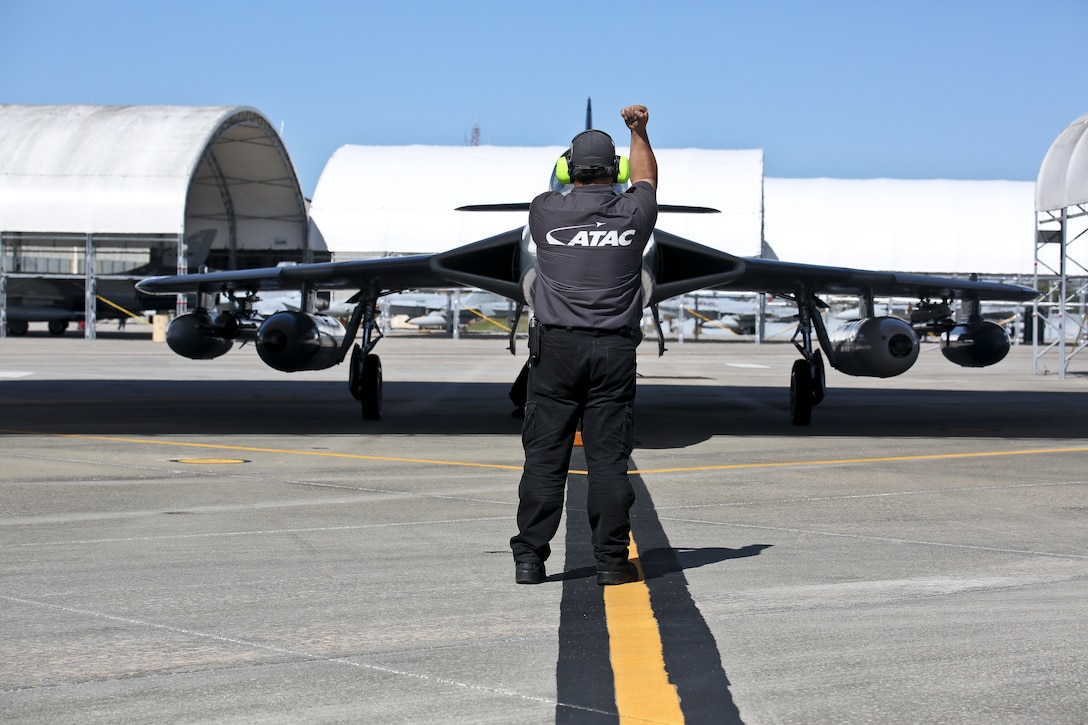 A crew chief conducts pre-flight checks on an MK-58 Hawker Hunter aboard Marine Corps Air Station Beaufort April 18. The Hawker Hunter and crew are training with Marine Fighter Attack Training Squadron 501 for multiple weeks to support dissimilar air combat training for F-35 pilots. The aircraft is with the Airborne Tactical Advantage Company.