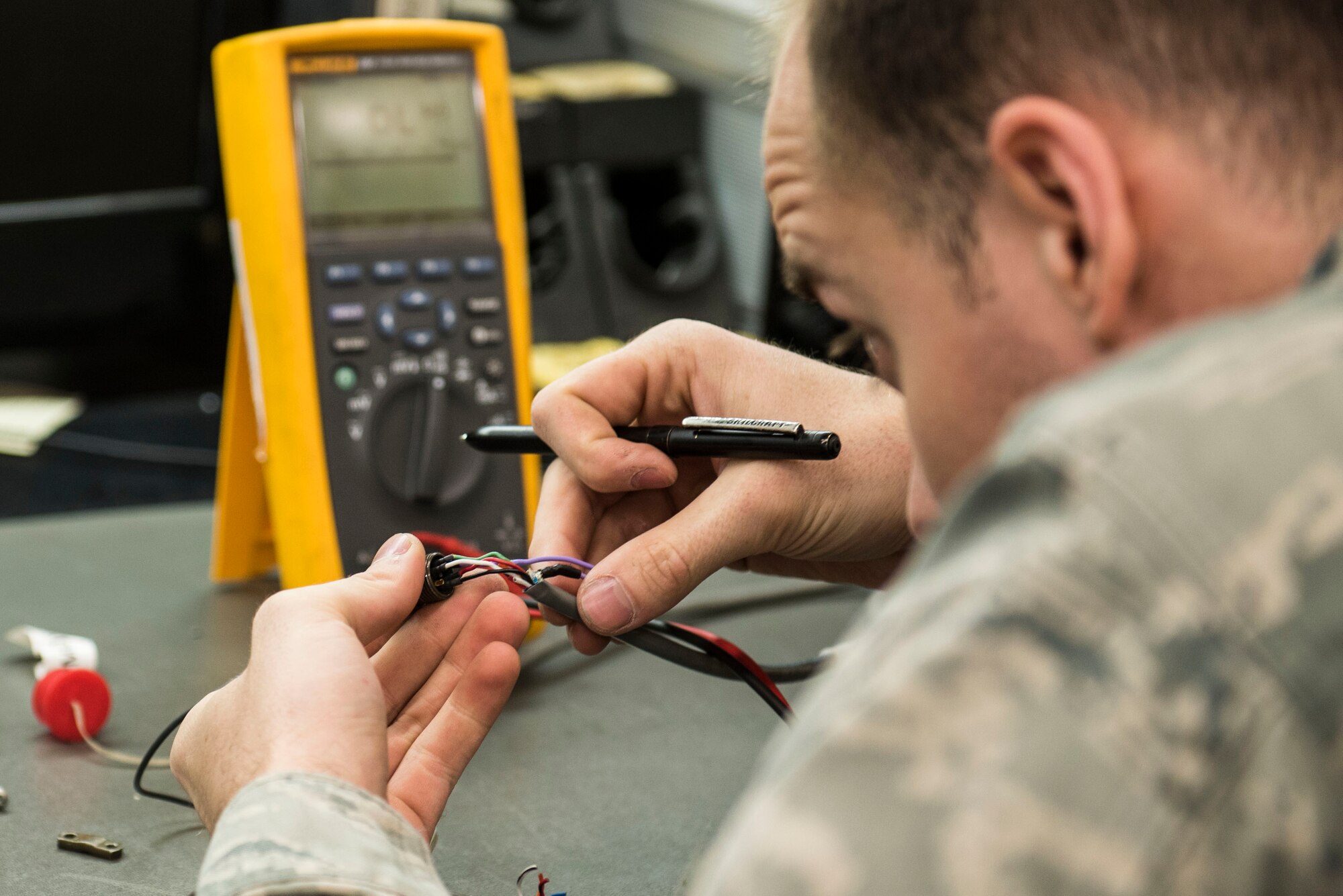 U.S. Air Force Staff Sgt. Brandon Henry, 20th Maintenance Group Air Force Repair Enhancement Program technician, performs preventative maintenance on a weight and balance kit cable at Shaw Air Force Base, S.C., April 20, 2018.