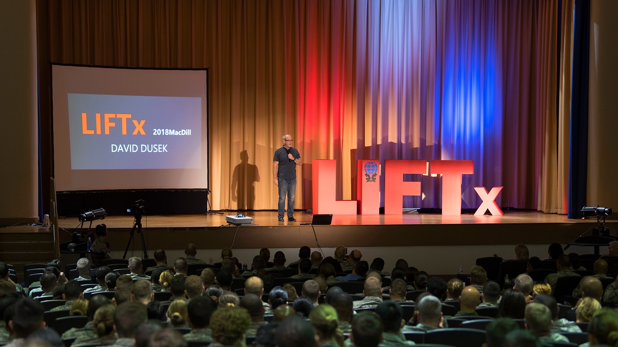 David Dusek, founder of Rough Cut Men Ministries, speaks during the Leaders Inspiring for Tomorrow seminar hosted by MacDill Air Force Base, Fla., April 19, 2018. Dusek spoke on the importance of having someone “to watch your six” through life as a way to prevent isolation and combat suicide. LIFTx brought together 10 diverse speakers from around the country who shared their stories of leadership, inspiration, innovation and resiliency.