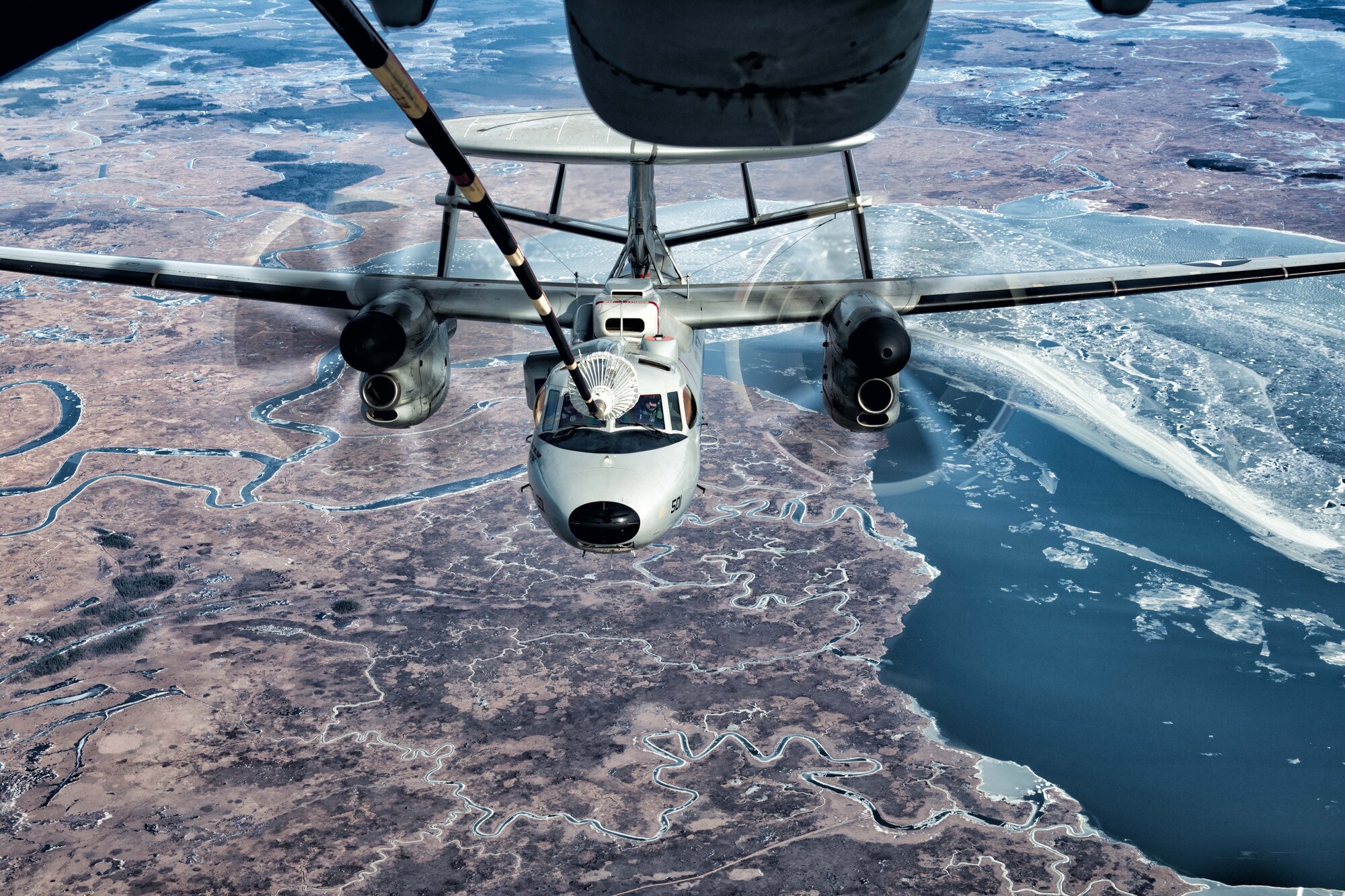 An E2-D Advanced Hawkeye from Naval Air Station Patuxent River, Md. approaches a KC-10 Extender from Joint Base McGuire-Dix-Lakehurst for an aerial refueling January 12. Members of the Naval Air Systems Command, NAS Patuxent River, Md. the 418th Flight Test Squadron, Edwards Air Force Base, Calif. and the 76th Air Refueling Squadron, JB MDL, N.J. spent two months testing and verifying the Hawkeye’s ability to refuel with the KC-10. The Advanced Hawkeye is the first version of the E2-D able to refuel mid-flight, extending its range, endurance and give it more flexibility in its missions. (Air Force photo by Master Sgt. Jamie Morton)