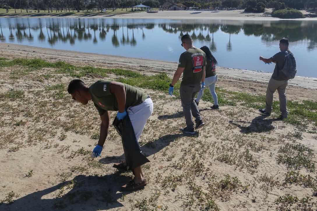 Marines with Marine Corps Air Station Miramar’s Single Marine Program pick up trash during a beach cleanup effort on Fiesta Island in San Diego, April 17. Marines volunteered as part of the SMP’s “Days of Service,” an initiative across several SMP offices, to recognize National Volunteer Month. During "Days of Service," Marines and Sailors supported local communities by conducting cleanups, volunteering at animal shelters and organizations that help veterans. (U.S. Marine Corps photo by Cpl. Daniel Auvert/Released)