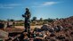 A explosive ordnance disposal technician from the 355th Civil Engineer Squadron assesses the fallout of a disarmed improvised unexploded ordnance during a training exercise at Davis-Monthan Air Force Base, Ariz., March 28, 2018. The exercise involved the discovery, assessment and disposal of unexploded ordnance on a mock runway. (U.S. Air Force photo by Airman 1st Class Michael X. Beyer)