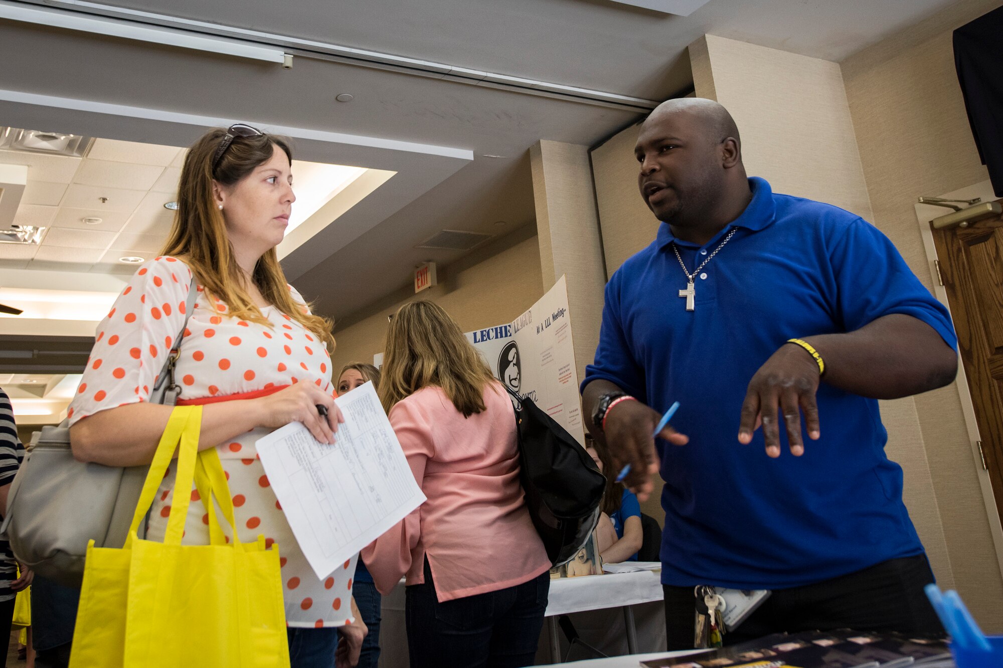 Davion Baynard, right, Lowndes County department of child federal services adoption counselor, speaks to a Team Moody spouse during a baby shower, April 14, 2018, at Moody Air Force Base, Ga. The baby shower provided attendants with various gifts and educational opportunities, the shower’s main focus this year was on raising awareness to the issue of child abuse. (U.S. Air Force photo by Airman 1st Class Eugene Oliver)