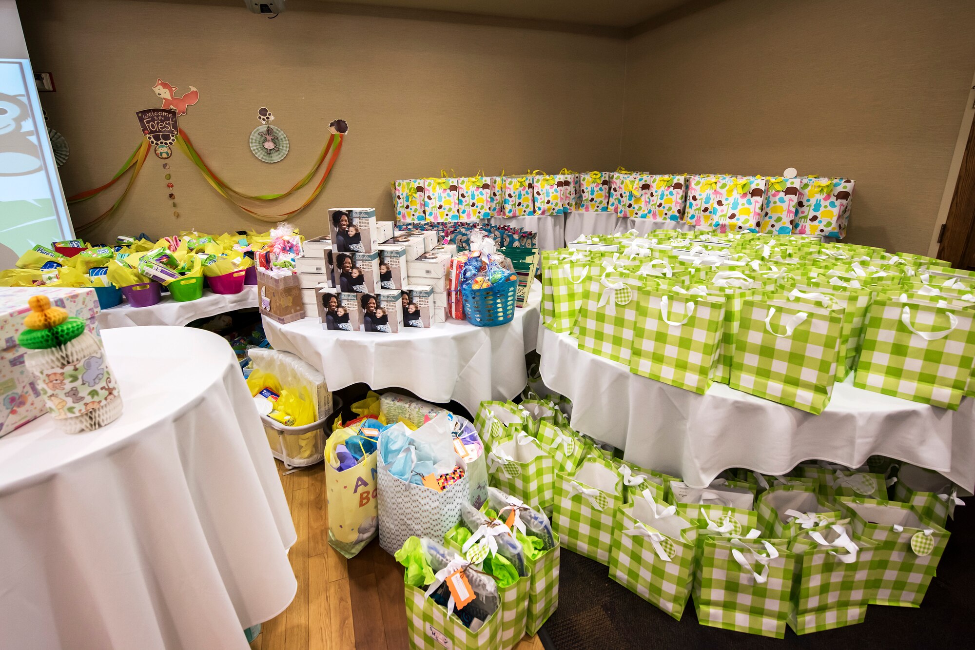 Prizes and gifts rest on a table during a baby shower, April 14, 2018, at Moody Air Force Base, Ga. The baby shower provided attendants with various gifts and educational opportunities, the shower’s main focus this year was on raising awareness to the issue of child abuse. (U.S. Air Force photo by Airman 1st Class Eugene Oliver)