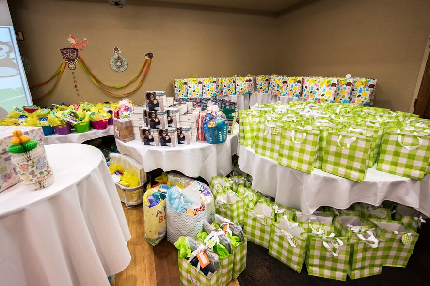 Prizes and gifts rest on a table during a baby shower, April 14, 2018, at Moody Air Force Base, Ga. The baby shower provided attendants with various gifts and educational opportunities, the shower’s main focus this year was on raising awareness to the issue of child abuse. (U.S. Air Force photo by Airman 1st Class Eugene Oliver)