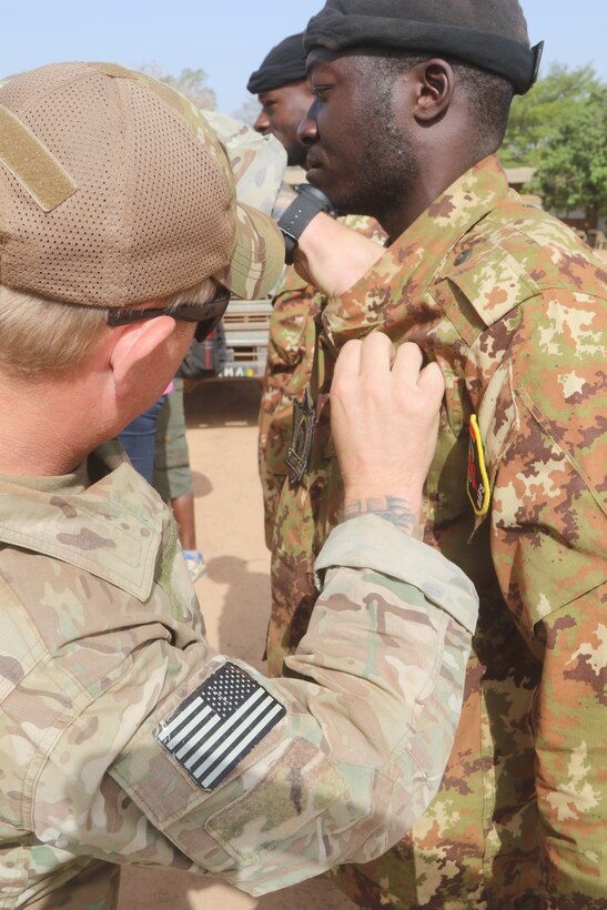 A Malian soldier receives U.S. jump wings after participating in a joint airborne operation conducted near Ouagadougou, Burkina Faso.