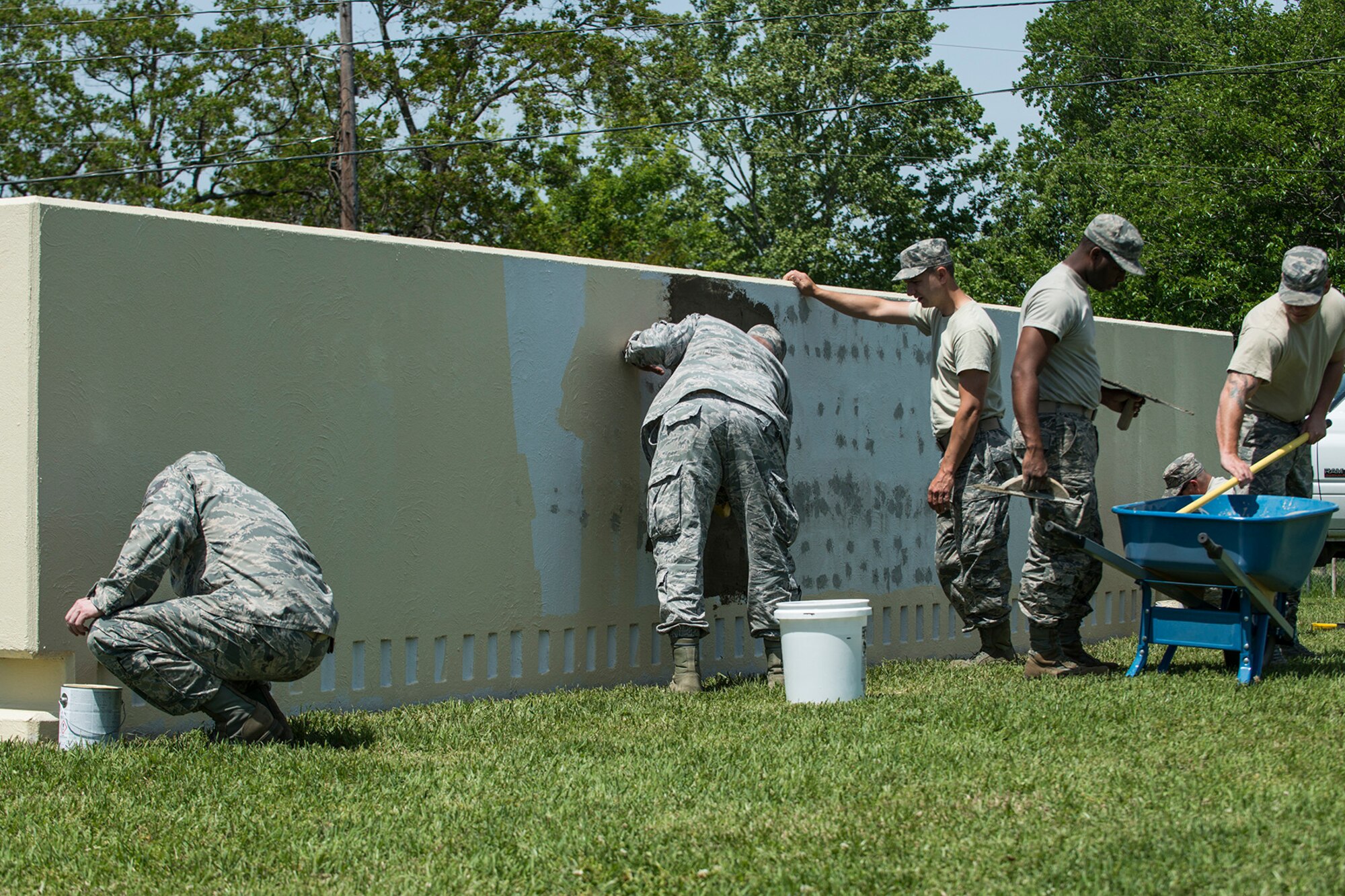 Members of the 307th Civil Engineer Squadron work to complete a makeover of the 307th Bomb Wing headquarters sign on April 11, 2018, Barksdale Air Force Base, La.