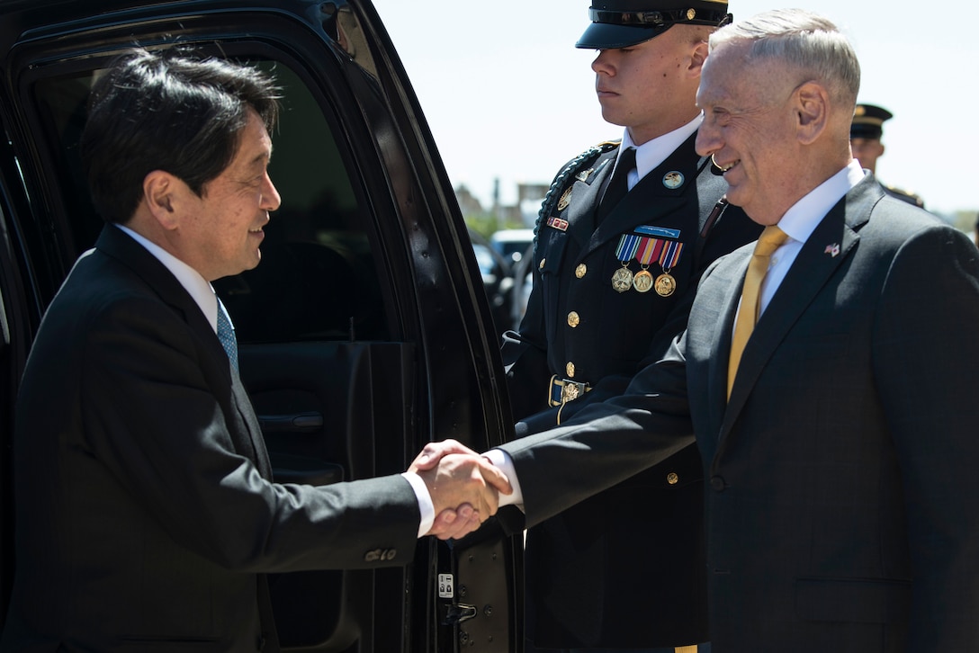 Defense Secretary James N. Mattis shakes hands with Japanese Defense Minister Itsunori Onodera.