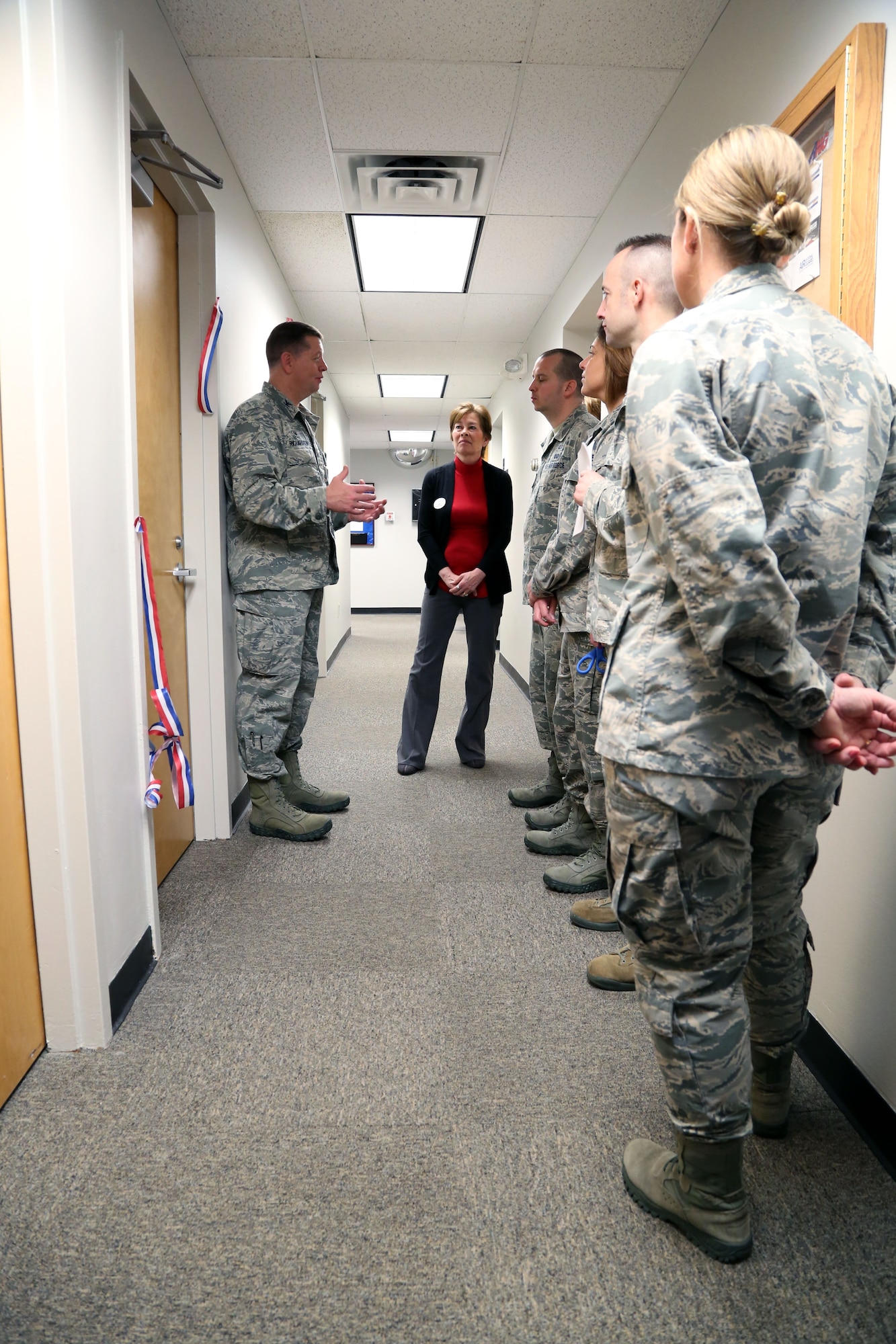 U.S. Air Force Col. Neil Richardson, Joint Base McGuire-Dix-Lakehurst and 87th Air Base Wing commander, speaks to a group of 87th Force Support Squadron members during a room dedication Feb. 21, 2018 at Joint Base McGuire-Dix-Lakehurst, N.J. The new Continuous Process Improvement classroom has an interactive projection system and white board walls so students and teams can use CPI tools to facilitate problem solving and innovative solutions during monthly Green and Yellow Belt classes.