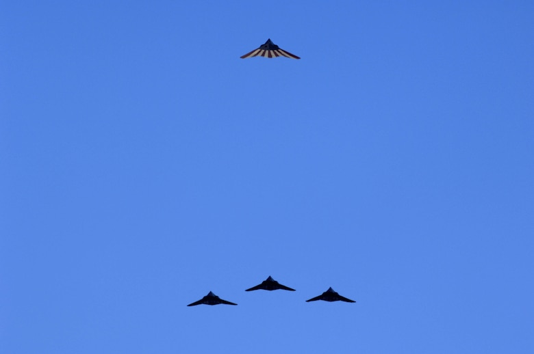 Four F-117A Nighthawk's perform one last flyover at the Sunset Stealth retirement ceremony at Holloman AFB, N.M., April 21, 2008. The F-117A flew under the flag of the 49th Fighter Wing at Holloman Air Force Base from 1992 to its retirement in 2008. (U.S. Air Force photo by Staff Sgt. Jason Colbert)