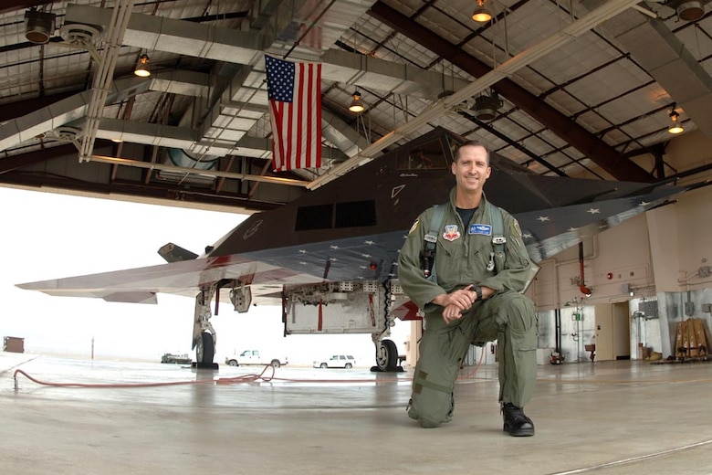 Retired Air Force Col. Jack Forsythe in front of the flag F-117 at Tonopah Air Force Base, Nev., after the last mission April 22, 2008. Forsythe led the four-ship formation that flew the Nighthawk to its resting place. (Courtesy photo)