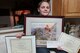 Mason Duggan, son of Lt. Col. Jerrod Duggan, 341st Maintenance Group deputy commander, poses with award certificates March 2, 2018, in Great Falls, Mont.