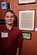 Mason Duggan, son of Lt. Col. Jerrod Duggan, 341st Maintenance Group deputy commander, poses next to his essay displayed at a museum March 2, 2018, in Great Falls, Mont.