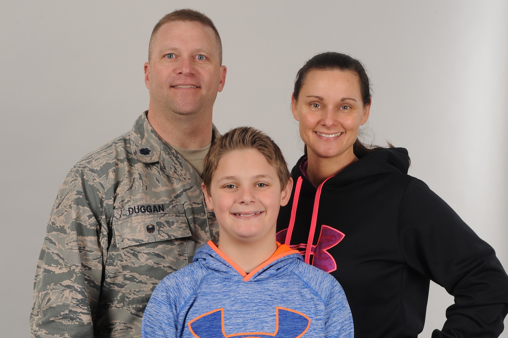 From left, Lt. Col. Jerrod Duggan, 341st Maintenance Group vice commander, his son Mason, and wife Kimberly, pose for a portrait April 2, 2018, at Malmstrom Air Force Base, Mont.
