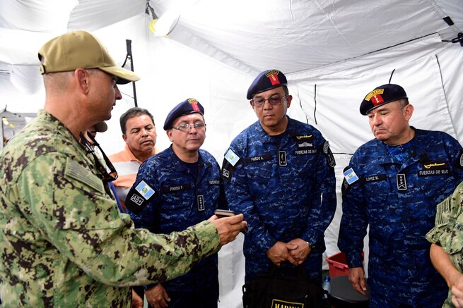 Military medical officials talk.