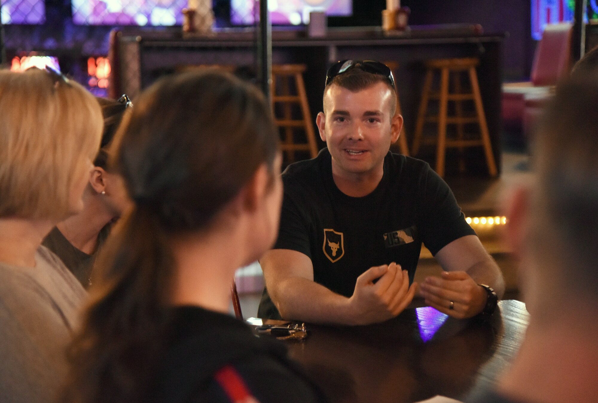 Second Lt. Joshua Field, 333rd Training Squadron student, and the 81st Training Wing commander’s support staff have a discussion during Dragon Chat at Big Play in Biloxi, Mississippi, April 19, 2018. Dragon Chat consisted of Airmen participating in small group discussions within their units to focus on building resiliency and team building initiatives. (U.S. Air Force photo by Kemberly Groue)