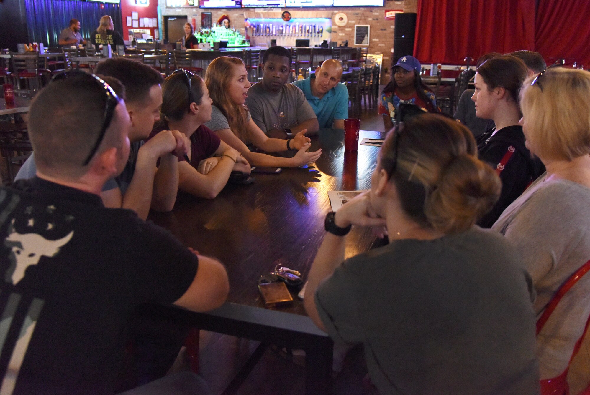 Members of the 81st Training Wing commander’s support staff have a discussion during Dragon Chat at Big Play in Biloxi, Mississippi, April 19, 2018. Dragon Chat consisted of Airmen participating in small group discussions within their units to focus on building resiliency and team building initiatives. (U.S. Air Force photo by Kemberly Groue)