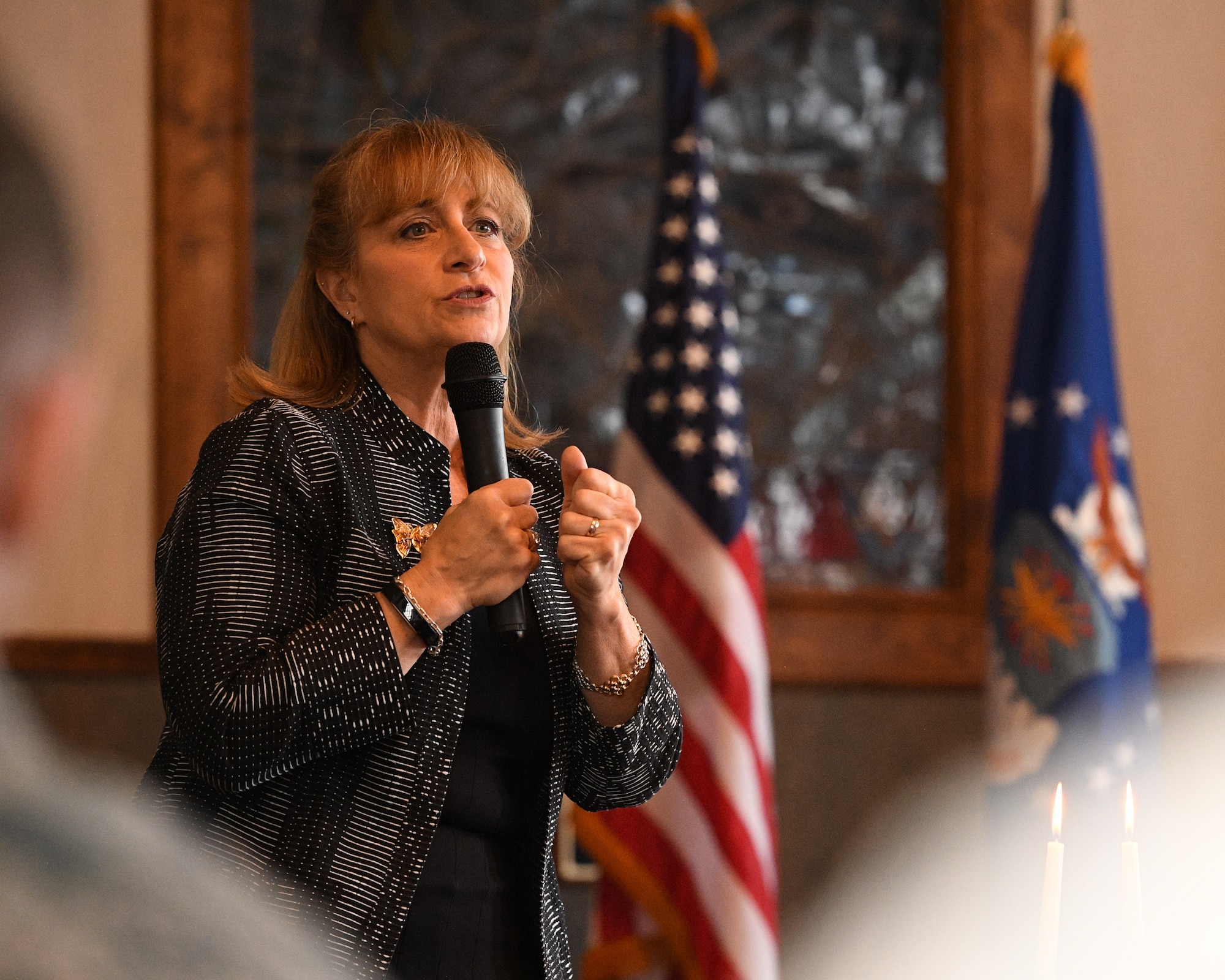 Diane Warsoff speaks during the Holocaust Days of Remembrance Service April 18, 2018, at Hill Air Force Base, Utah. Warsoff is a second-generation Holocaust survivor. Her mother and grandparents survived the Holocaust by hiding in France during World War II. In 2015, she traveled to Europe and met the family that rescued her mother and grandparents. (U.S. Air Force photo by R. Nial Bradshaw)