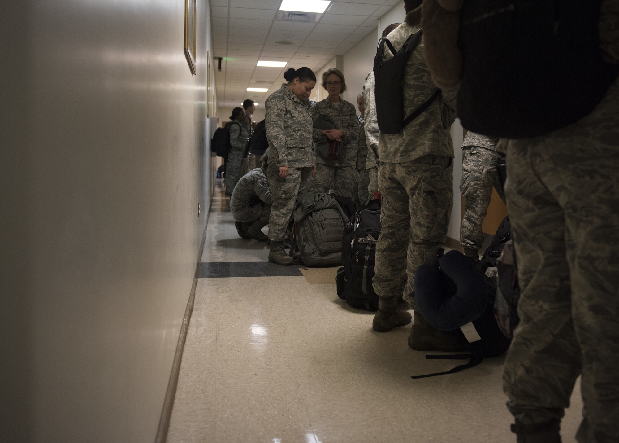 Airmen from the 81st Medical Group in process at the Roberts Consolidated Aircraft Maintenance Facility at Keesler Air Force Base, Mississippi, April 16, 2018. Ninety-nine Airmen from the 81st MDG traveled to Indiana to help set up a medical facility in support of Joint Task Force Civil Service. More than 3,200 Defense Department and civilian medical personnel are participating in the operation. (U.S. Air Force photo by Senior Airman Holly Mansfield)
