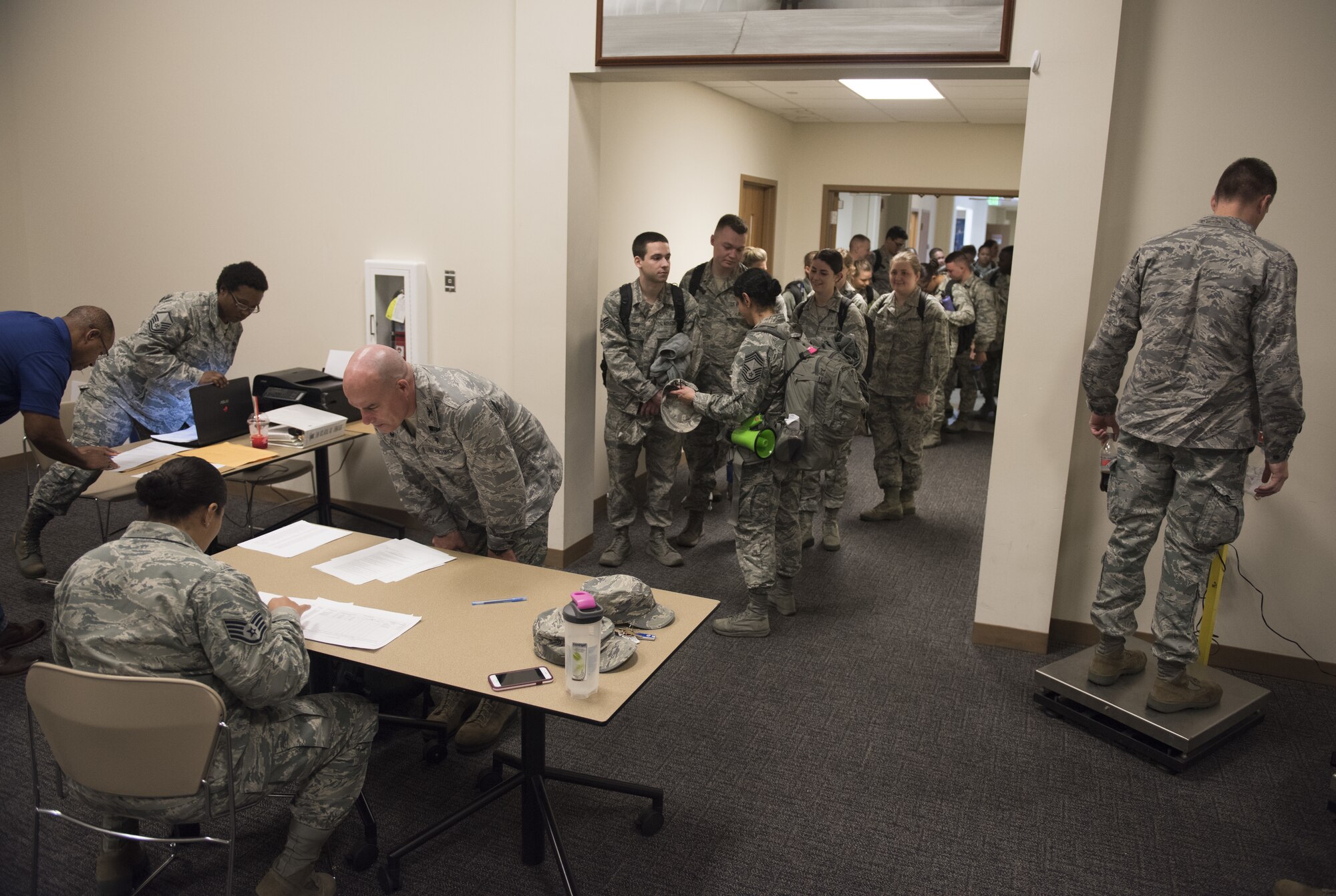 Airmen from the 81st Medical Group in process at the Roberts Consolidated Aircraft Maintenance Facility at Keesler Air Force Base, Mississippi, April 16, 2018. Ninety-nine Airmen from the 81st MDG traveled to Indiana to help set up a medical facility in support of Joint Task Force Civil Service. More than 3,200 Defense Department and civilian medical personnel are participating in the operation. (U.S. Air Force photo by Senior Airman Holly Mansfield)