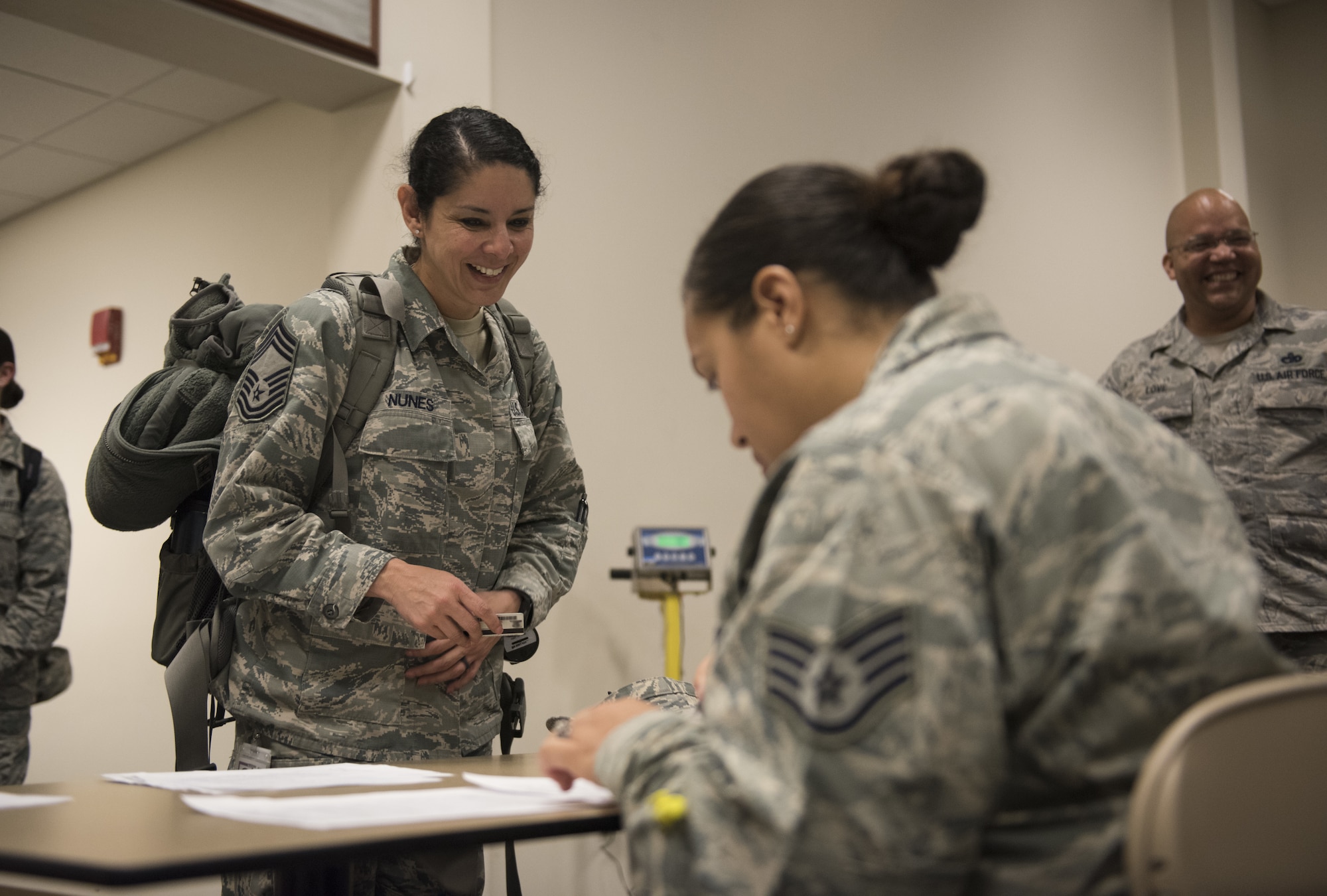 U.S. Air Force Chief Master Sgt. Sandra Nunes, 81st Medical Operations Squadron superintendent, in processes at the Roberts Consolidated Aircraft Maintenance Facility at Keesler Air Force Base, Mississippi, April 16, 2018. Ninety-nine Airmen from the 81st Medical Group traveled to Indiana to help set up a medical facility in support of Joint Task Force Civil Service. More than 3,200 Defense Department and civilian medical personnel are participating in the operation. (U.S. Air Force photo by Senior Airman Holly Mansfield)