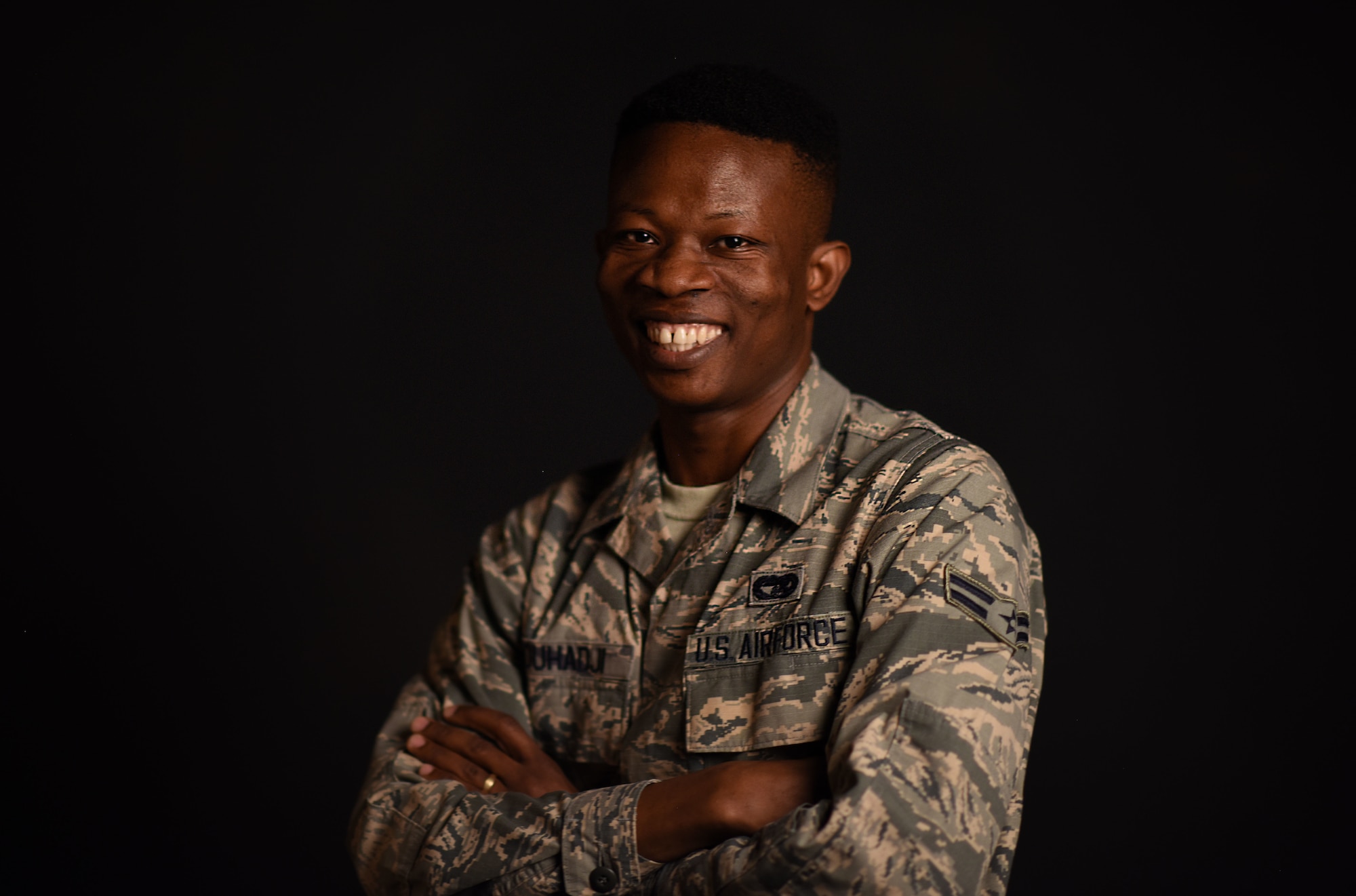Airman 1st Class Kofi Combey Douhadji, 92nd Logistics Readiness Squadron vehicle operator, poses for a photo at Fairchild Air Force Base, Washington, April 17, 2018. Douhadji and his family participated in the online Diversity Visa Lottery Program and were selected by the program to immigrate to the U.S with a 10-year visa. Six months after arriving in the U.S., Douhadji enlisted in the U.S. Air Force. (U.S. Air Force photo/Airman 1st Class Jesenia Landaverde)