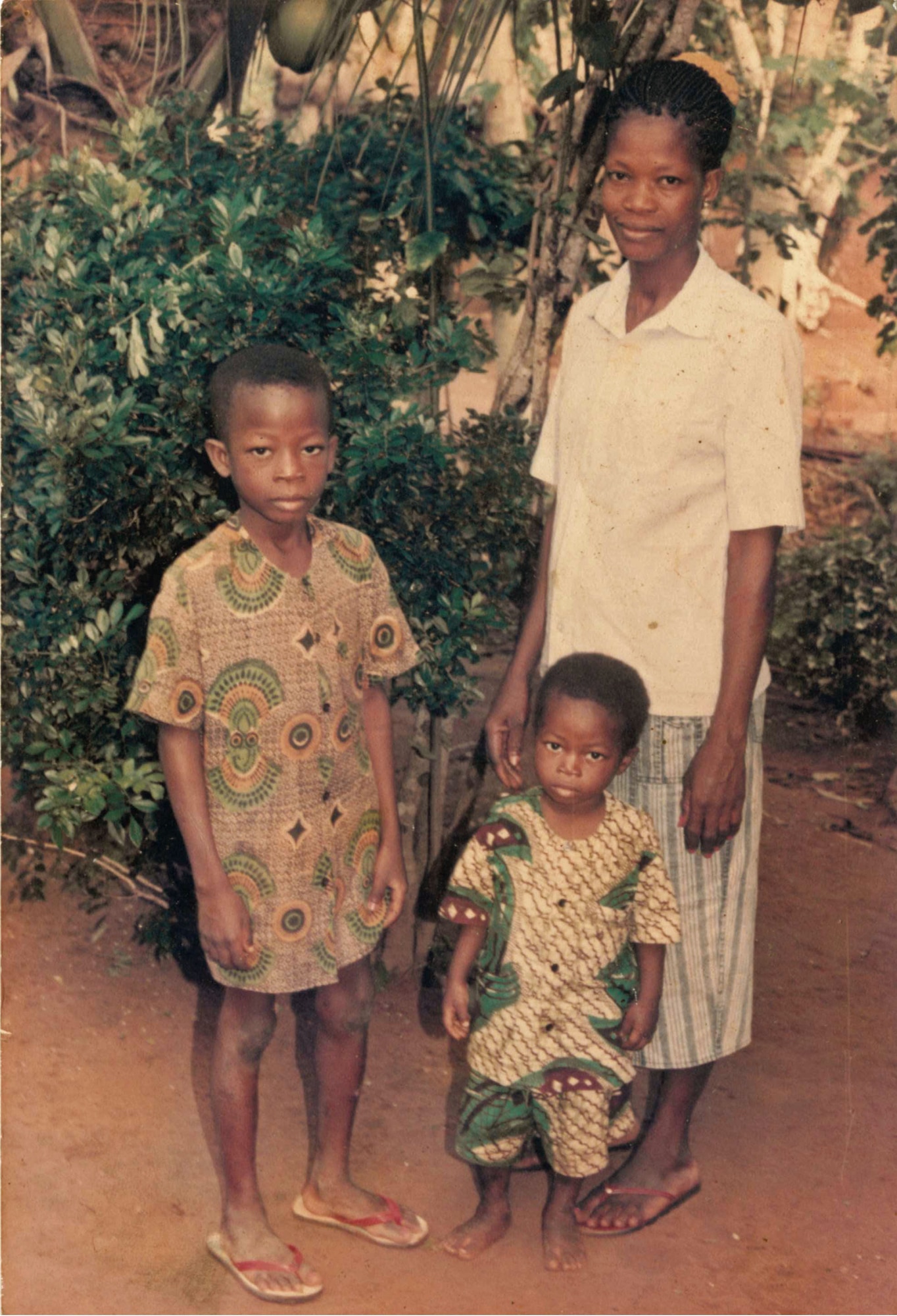 Airman 1st Class Kofi Combey Douhadji, 92nd Logistics Readiness Squadron vehicle operator, poses for a photo with his mother and younger brother in Togo, West Africa. Douhadji started reading about American culture and history as a young man in Togo, slowly learning about the English language and life in America. (Courtesy Photo)