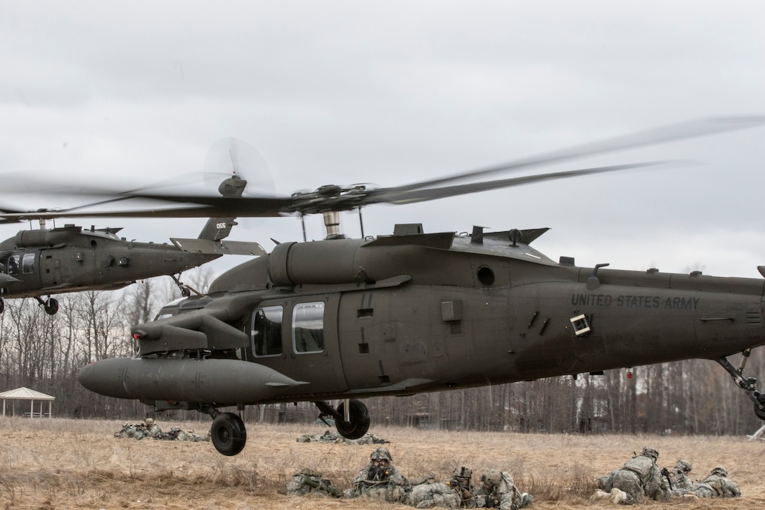 The 10th Combat Aviation Brigade conducts a troop air insertion as part of the Falcon’s Peak aviation training exercise at Sexton Field at Fort Drum, N.Y.