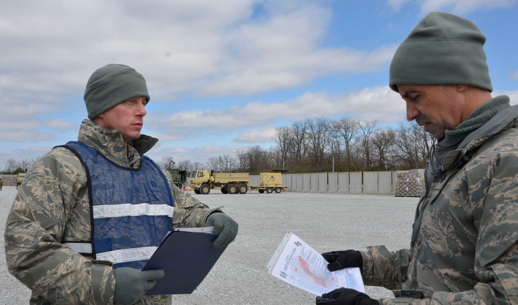 Capt. Lee Laughridge, Air Forces Northern Medical Operations and Training chief, discusses the exercise scenario with Lt. Col. Jack Vilardi, 81st Medical Group operations officer, during the Expeditionary Medical Support field confirmation exercise at Camp Atterbury, Indiana, April 17, 2018. The confirmation exercise evaluated the tactics, techniques and procedures of EMEDS operations during a domestic U.S. contingency such as a natural disaster. (U.S. Air Force photo by Mary McHale)