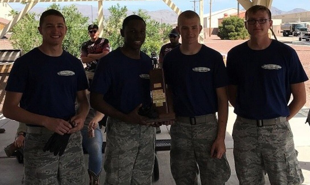 The winning team of the 2018 Petroleum, Oil, and Lubricants “Roadeo” competition, from the 56th Logistics Readiness Squadron at Luke Air Force Base, Ariz., pose for a picture with their trophy April 9, 2018, at Nellis AFB, Nev. The team used dedicated training and good communication skills to beat the competition. (Courtesy Photo)