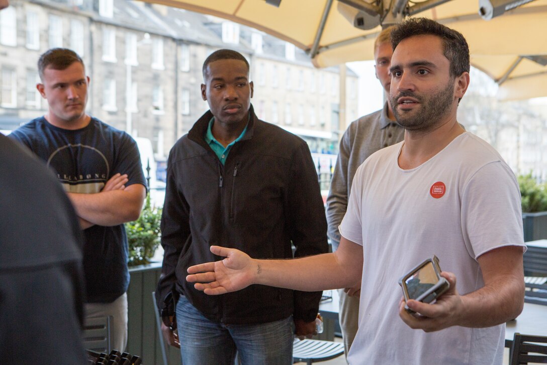 Jorge Perdomo (center), founder and chief executive officer of goTenna, talks to Reserve Marines with 4th Air Naval Gunfire Liaison Company, Force Headquarters Group, about new and emerging technology in the communications field, in Edinburgh, Scotland, April 20, 2018.
