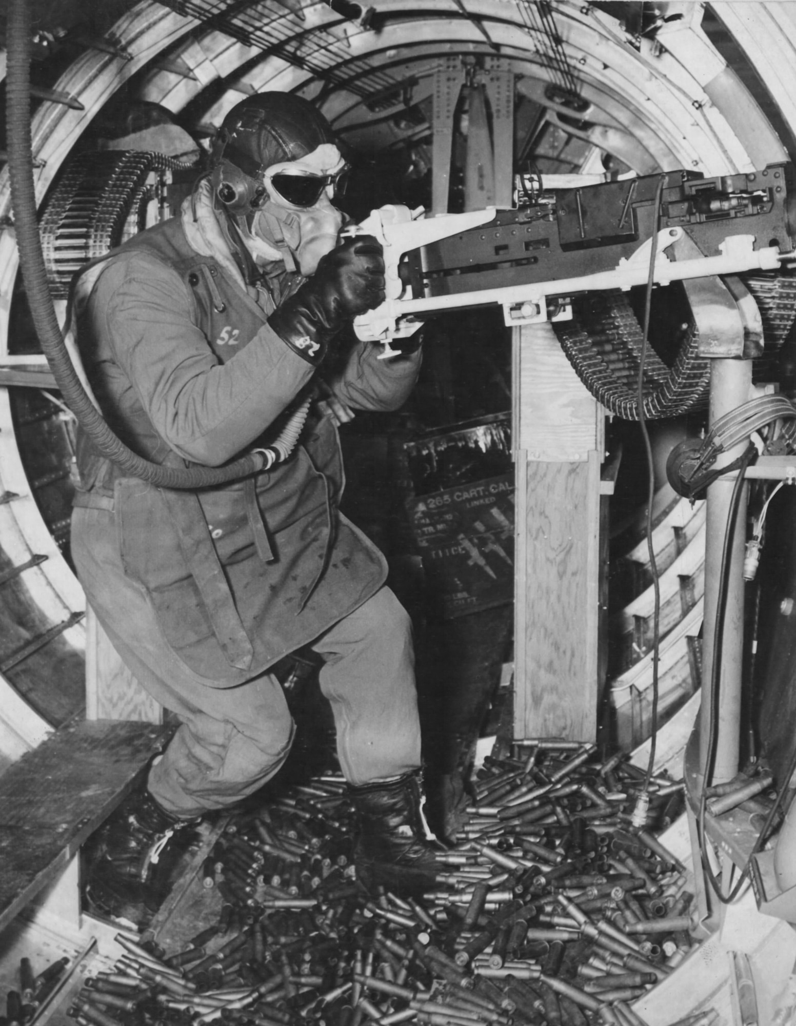 Waist gunner wearing typical body armor for a standing crewman—unlike the seated type, the apron was larger and the back was armored.  It weighed about 25 lbs.