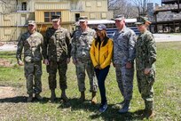 Army Maj. Gen. Richard Gallant, commander, Joint Task Force Civil Support (JTF-CS), and his command group pose for a photo with ABC11 Eyewitness News reporter Morgan Norwood at Muscatatuck Urban Training Center, Ind. Apr 20, 2018. JTF-CS is currently engaged in exercise Vibrant Response, an annual exercise that tests JTF-CS’s and the Defense Chemical, Biological, Radiological and Nuclear Response Force (DCRF)’s ability to respond to a catastrophic event. JTF-CS provides command and control for designated Department of Defense specialized response forces to assist local, state, federal and tribal partners in saving lives, preventing further injury and providing critical support to enable community recovery. (U.S. DoD photo by Mass Communication Specialist 3rd Class Michael Redd/released)