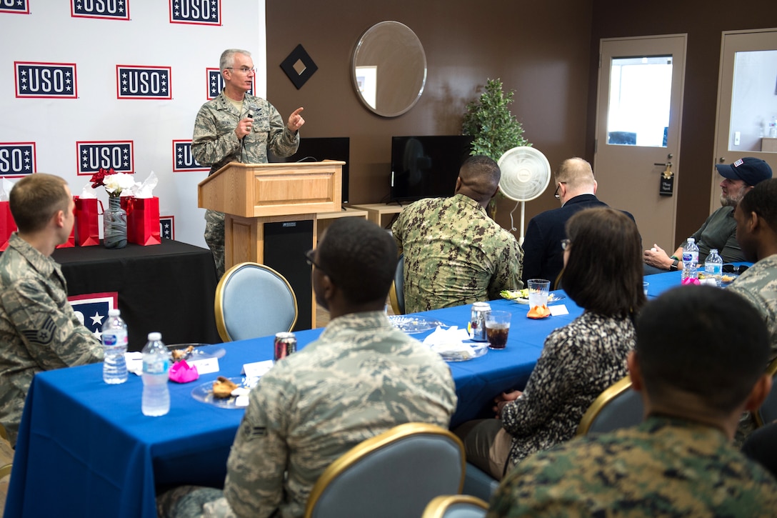 The vice chairman of the Joint Chiefs of Staff speaks to service members from behind a podium.