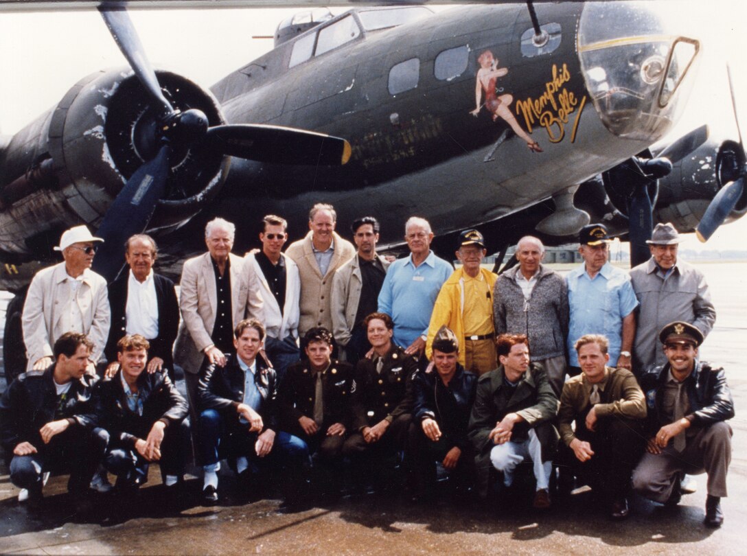 A 1990 fictionalized Hollywood movie produced by Wyler’s daughter Catherine added to their fame.  Here Memphis Belle crewmen are pictured with the actors who portrayed them, in front of a B-17 painted to resemble the Memphis Belle. (Courtesy of the Memphis Belle Memorial Association)