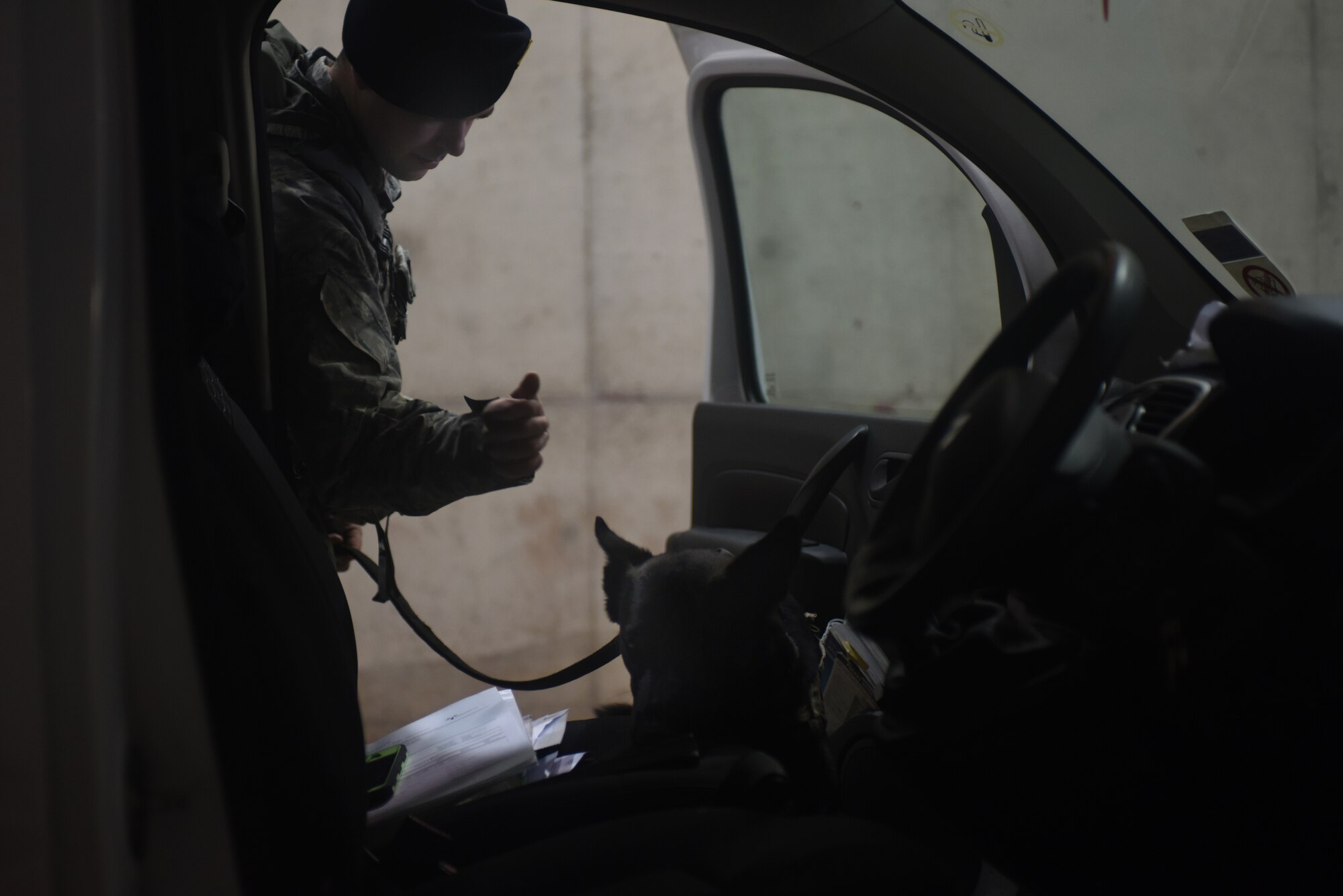 Staff Sgt. Bryce Bates, 48th Security Forces Squadron military working dog handler, and MWD Gorro sweep for explosives at Royal Air Force Lakenheath, England, April 18, 2018. The MWD handlers and their K-9 partners work daily to ensure no unauthorized explosive materials enter the base. (U.S. Air Force photo by Senior Airman Eli Chevalier)