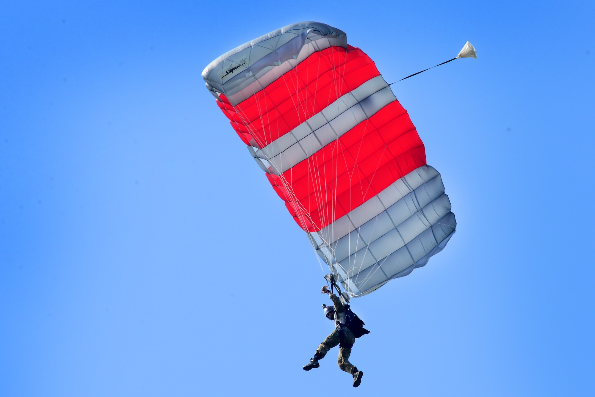 A pararescueman assigned to the 57th Rescue Squadron makes his final jump over Royal Air Force Lakenheath, England April, 20. The event signals the final phase of the two squadrons relocation to Aviano Air Base, Italy this spring. (U.S. Air Force photo/Tech. Sgt. Matthew Plew)