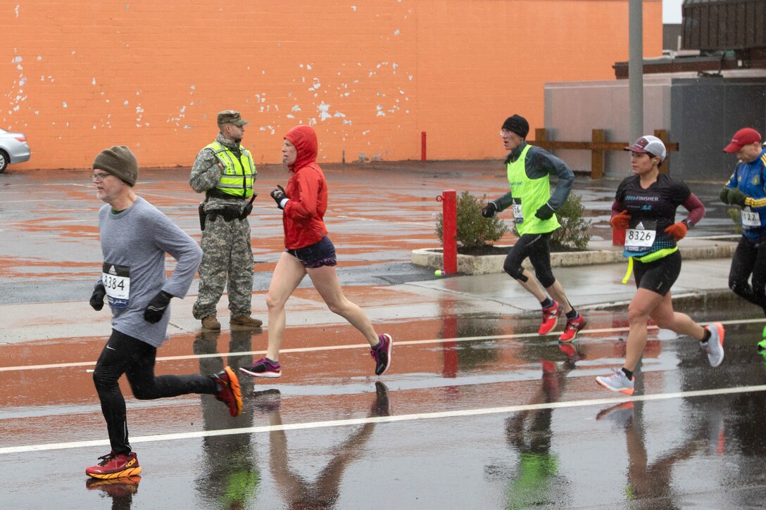 A soldier provides security during the 122nd Boston Marathon.